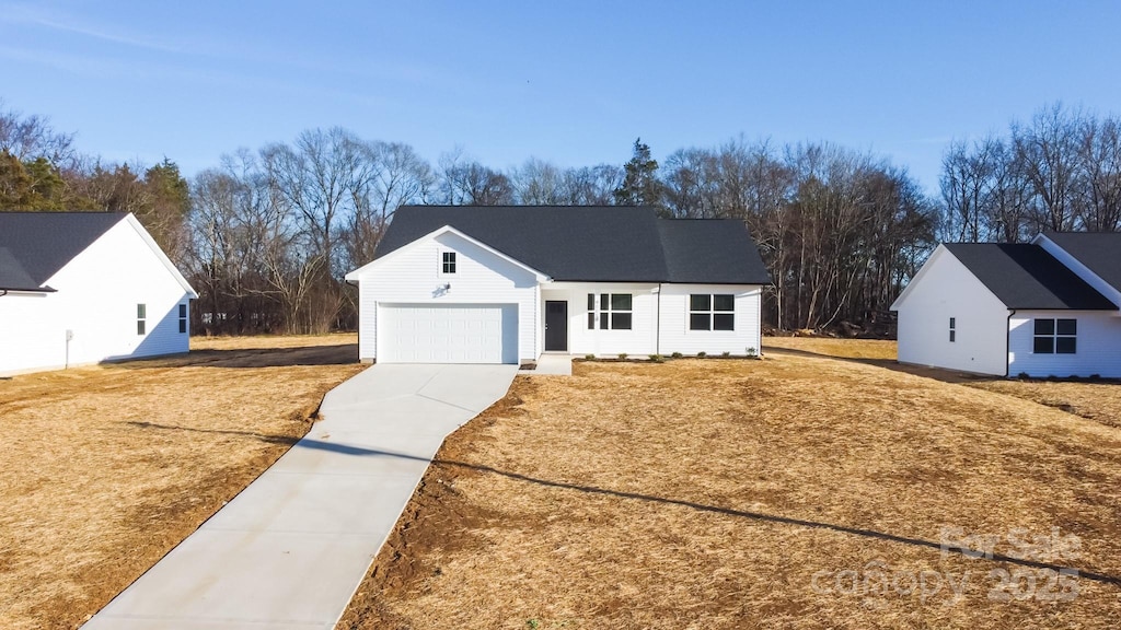 ranch-style home featuring a garage