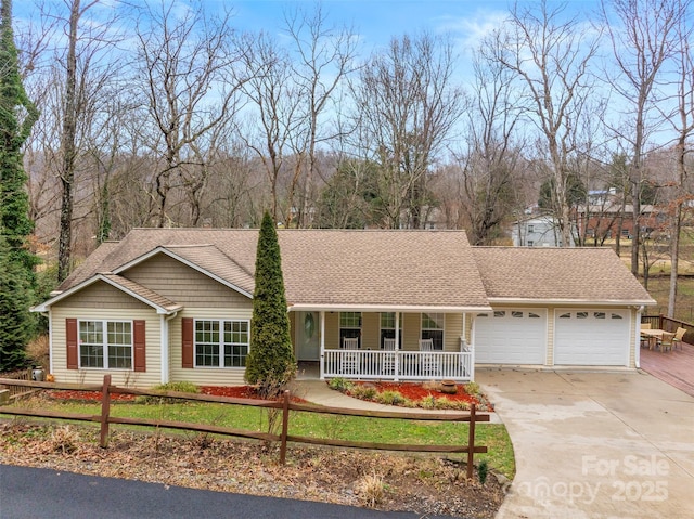 ranch-style home featuring a porch and a garage