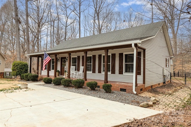 view of front of house with a porch and central AC unit