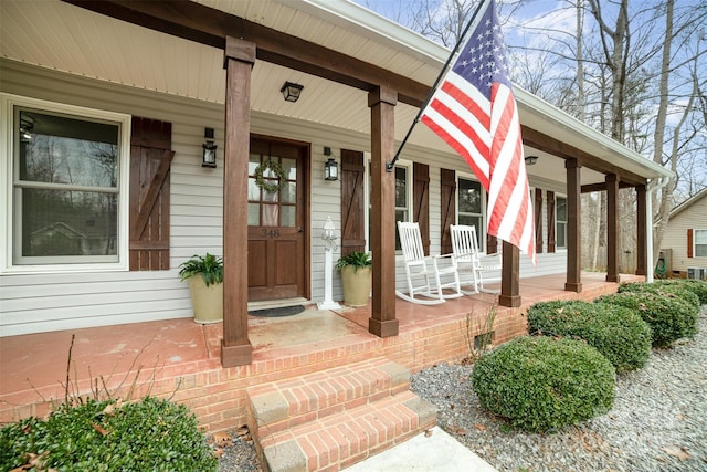 doorway to property featuring covered porch