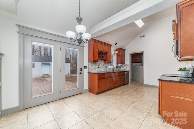 kitchen featuring a chandelier, dishwasher, sink, and light tile patterned floors