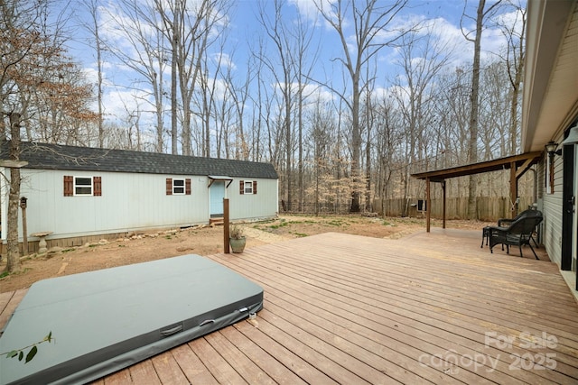 wooden deck featuring an outbuilding