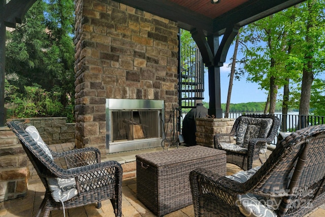 view of patio / terrace with an outdoor stone fireplace