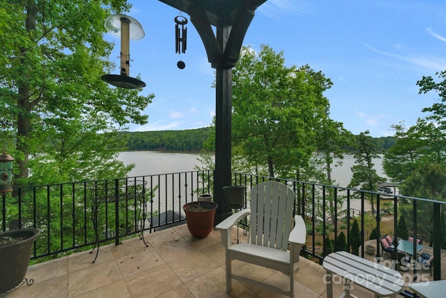 balcony featuring a water view