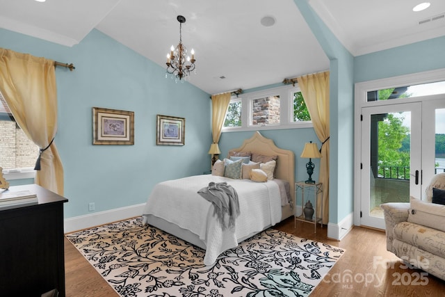 bedroom with light hardwood / wood-style floors, access to exterior, and ornamental molding