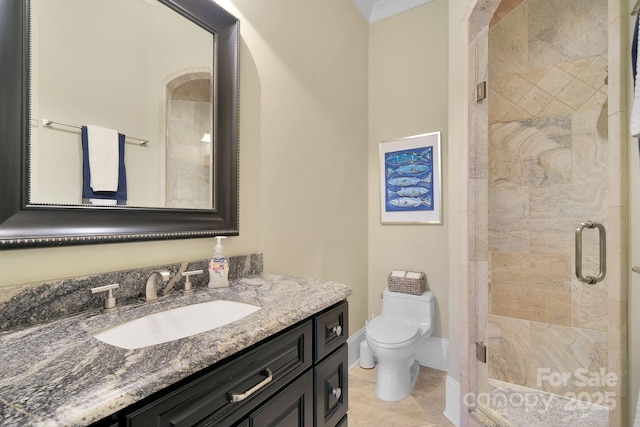 bathroom featuring vanity, toilet, and walk in shower