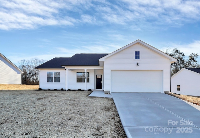 view of front of house with a garage and covered porch