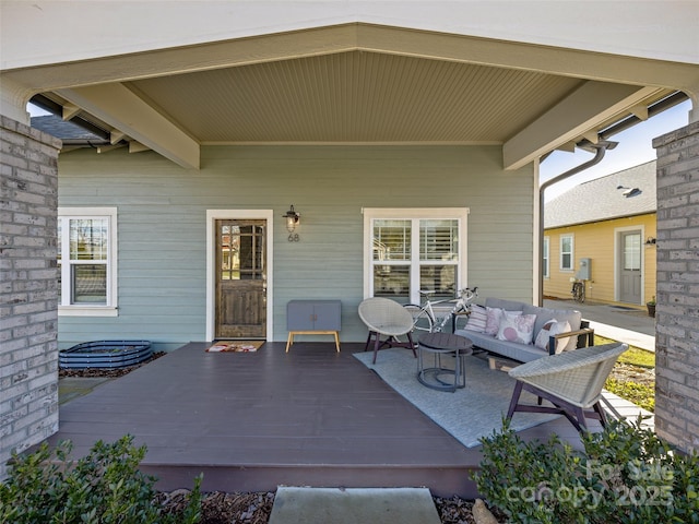 view of patio with a wooden deck and an outdoor hangout area