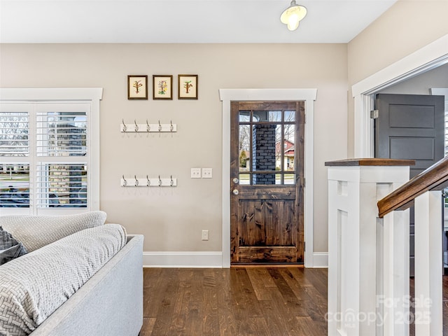 foyer entrance featuring dark hardwood / wood-style floors