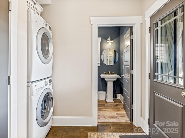 laundry room with sink and stacked washing maching and dryer