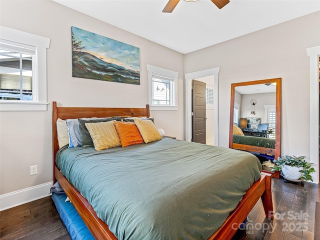 bedroom featuring ceiling fan and dark wood-type flooring