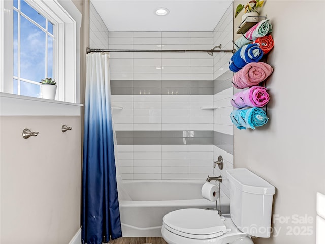 bathroom with shower / bath combo and toilet