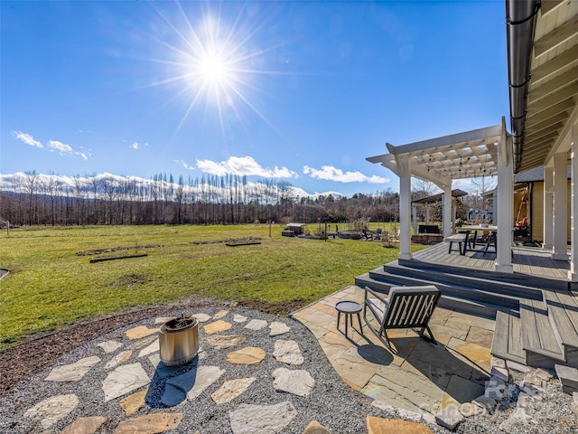 view of patio / terrace with a mountain view, a rural view, and a pergola