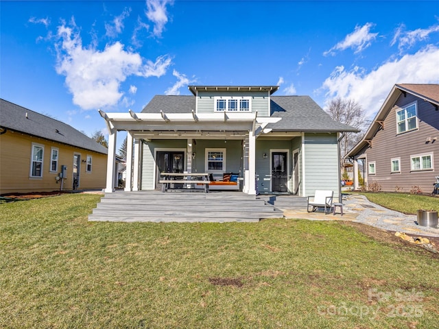 rear view of property with a lawn, a pergola, and a patio area