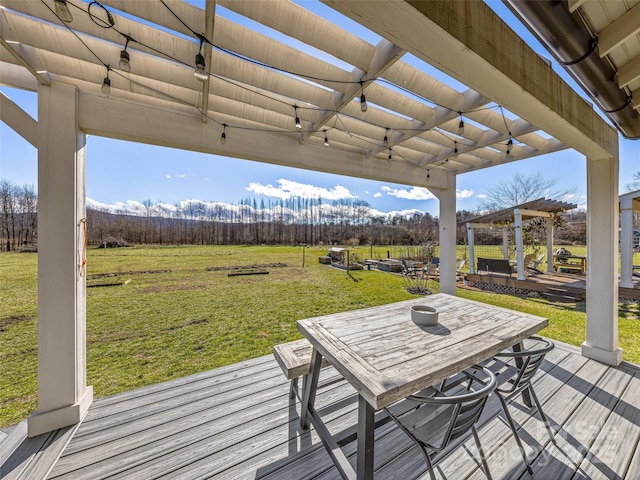 wooden terrace with a yard, a pergola, and a rural view