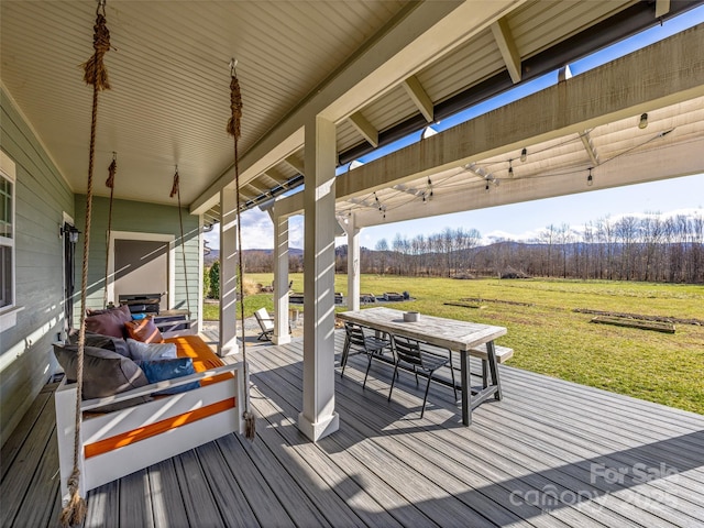 wooden deck featuring a rural view