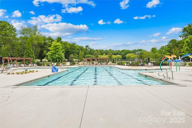 view of swimming pool featuring a patio area