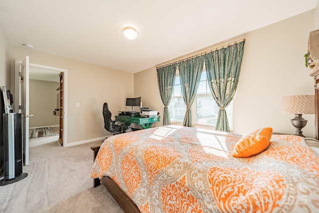 bedroom featuring light carpet