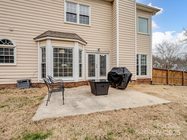 rear view of property with a patio and french doors