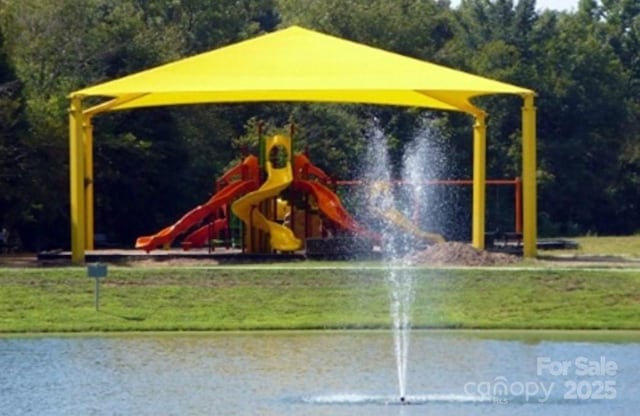 view of play area featuring a water view