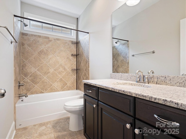 full bathroom featuring vanity, toilet, and tiled shower / bath