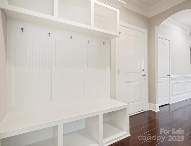 mudroom with dark wood-type flooring and ornamental molding