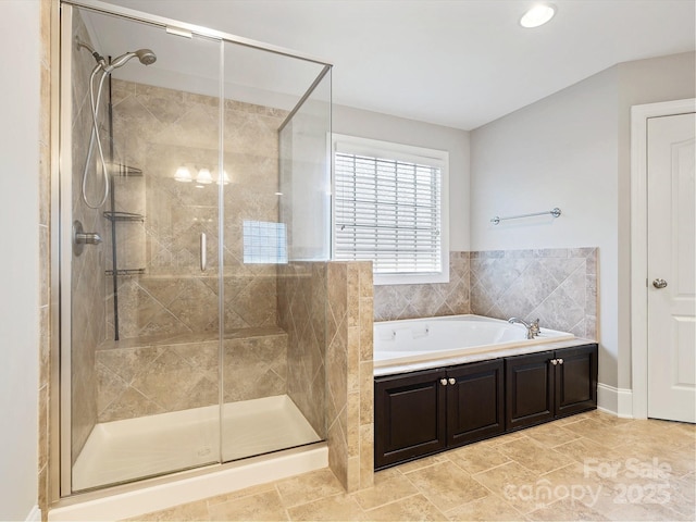 bathroom with tile patterned floors and plus walk in shower