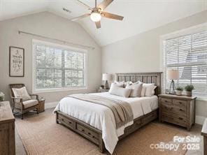 carpeted bedroom with multiple windows, lofted ceiling, and ceiling fan