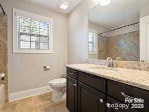 full bathroom with vanity,  shower combination, and toilet