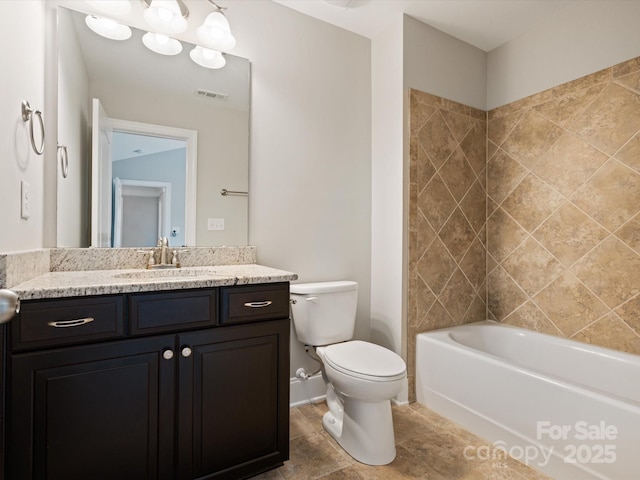 full bathroom with vanity, shower / bath combination, and toilet