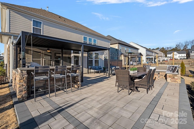 view of patio featuring exterior bar