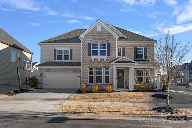 view of front facade featuring driveway, an attached garage, roof with shingles, and brick siding