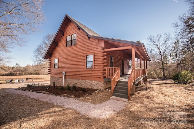 view of side of property featuring a porch