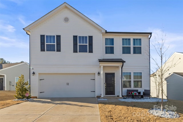 front of property with a garage