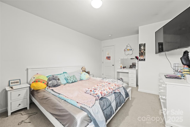 bedroom featuring light carpet