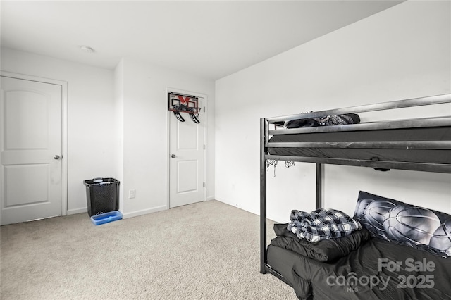 bedroom with light colored carpet