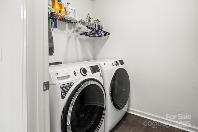 washroom featuring washer and dryer and dark hardwood / wood-style flooring