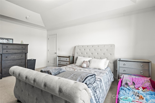 bedroom with carpet flooring, vaulted ceiling, and crown molding