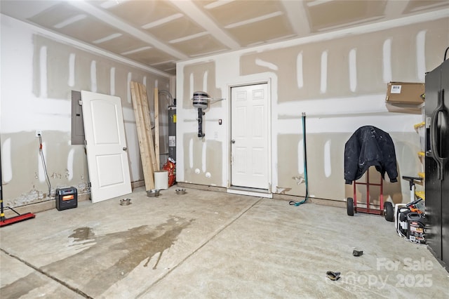 garage with electric panel, black fridge with ice dispenser, and electric water heater