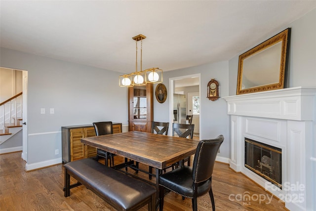 dining area with dark hardwood / wood-style flooring