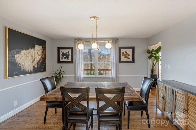 dining area with dark hardwood / wood-style floors