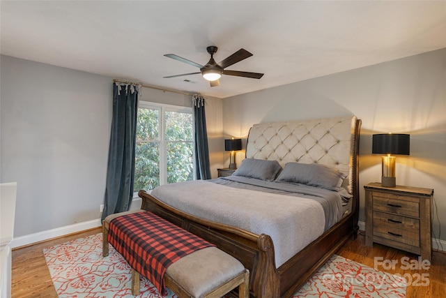 bedroom featuring wood-type flooring and ceiling fan