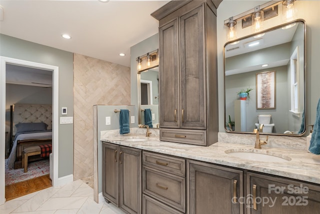 bathroom with vanity and toilet