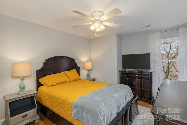 bedroom featuring hardwood / wood-style floors and ceiling fan