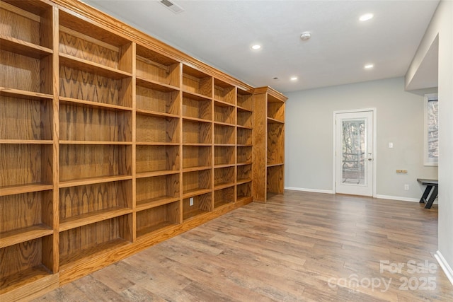 wine cellar featuring hardwood / wood-style floors