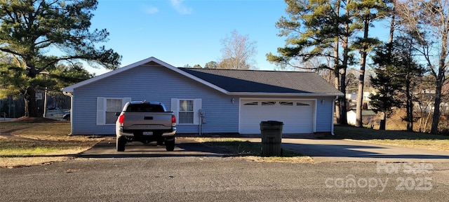 ranch-style home featuring a garage