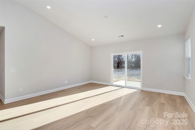 spare room with light wood-type flooring