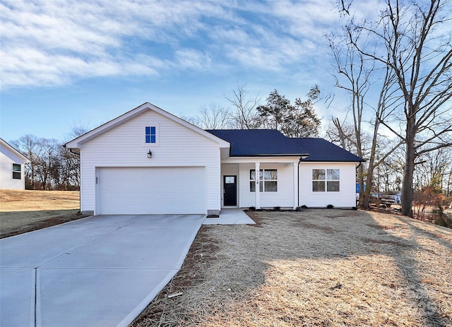 view of front of property featuring a porch and a garage