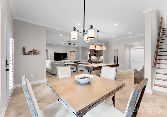 dining area with ornamental molding and ceiling fan