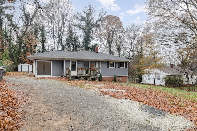 view of front of property featuring a storage unit